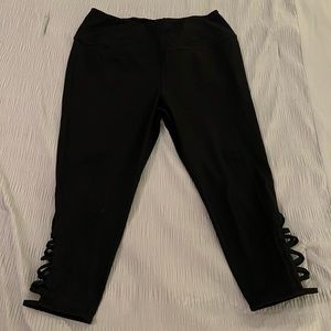 Torrid black leggings with cris cross